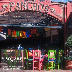 Colorful chairs and tables in a streetside cafe in Cabo San Lucas, Mexico at the southern tip of the Baja Peninsula